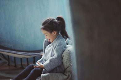 girl plays on phone